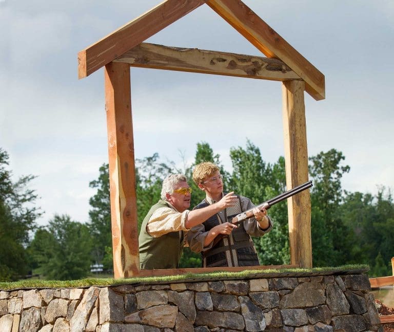 Two men skeet shooting