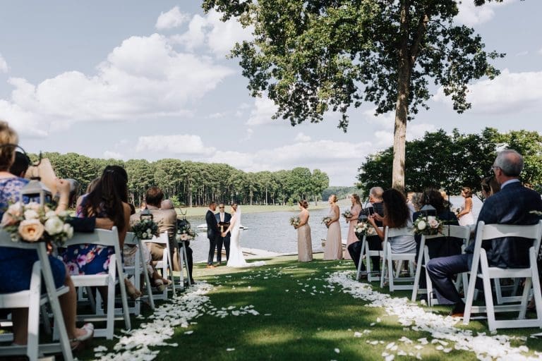 A wedding taking place outside overlooking Lake Oconee